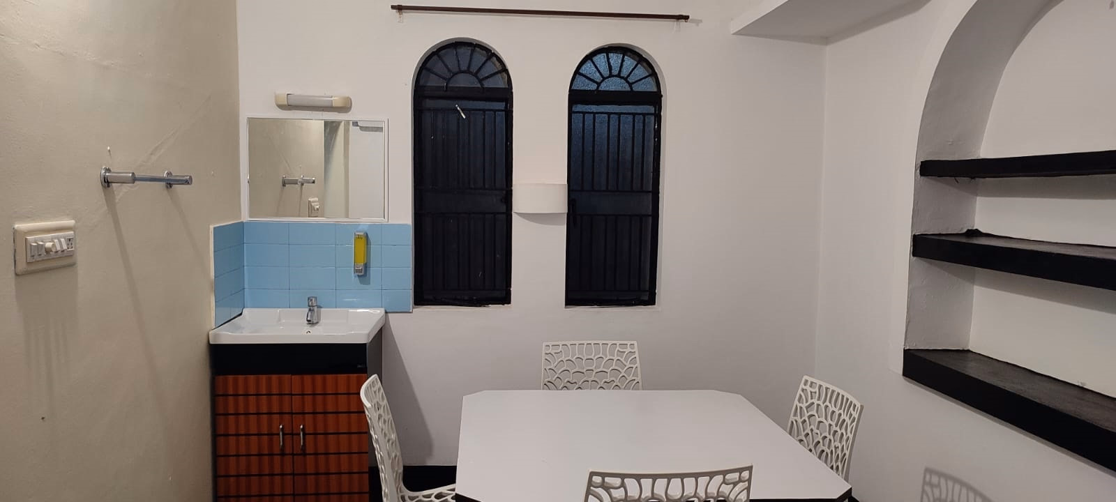 Dining space with arched windows