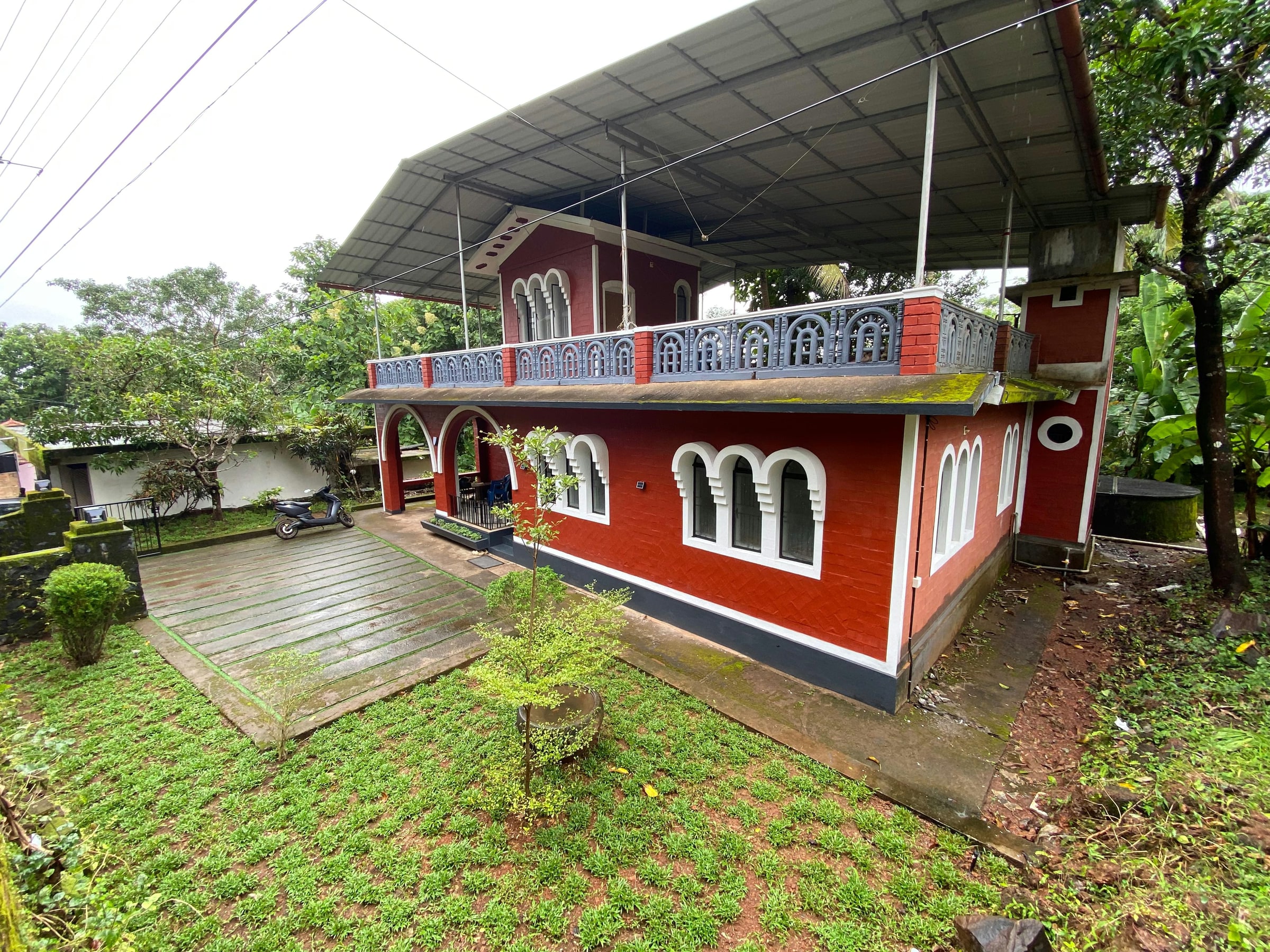 Side elevation of Vysakham Heritage beside the garden path